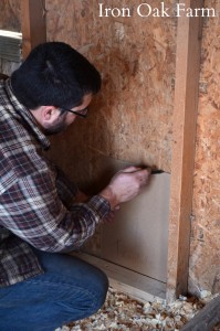 The door comes with a cardboard template that you trace on the wall of your coop.