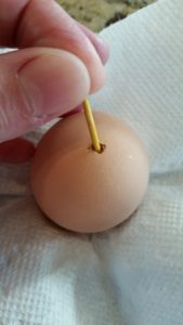 use a toothpick to break up the yolk