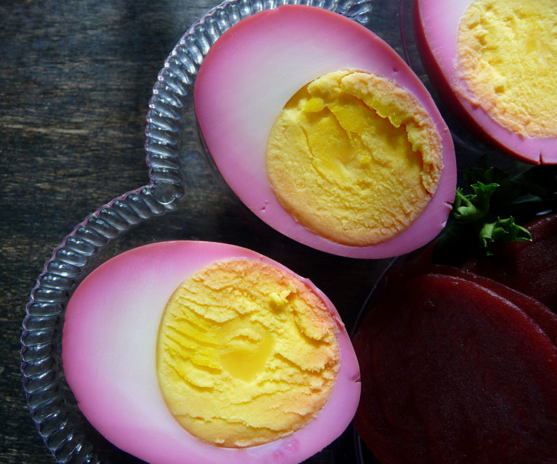Slice, hard-boiled eggs with pink edges