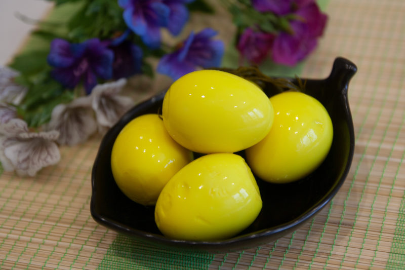 yellow-tinted hard-boiled eggs